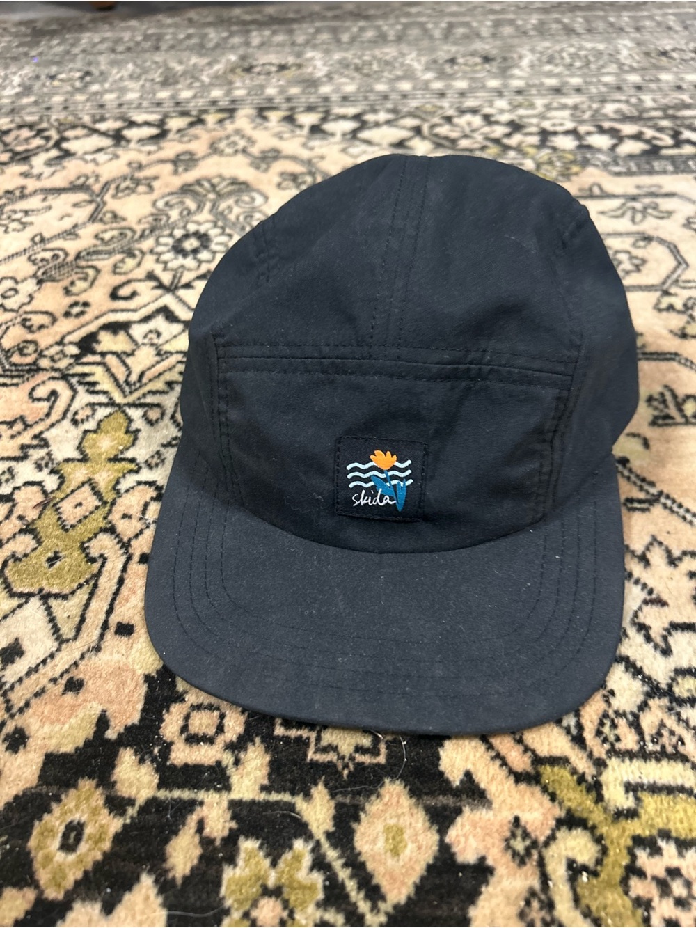 Skida Black 5-Panel Cap with Embroidered Nautical Patch